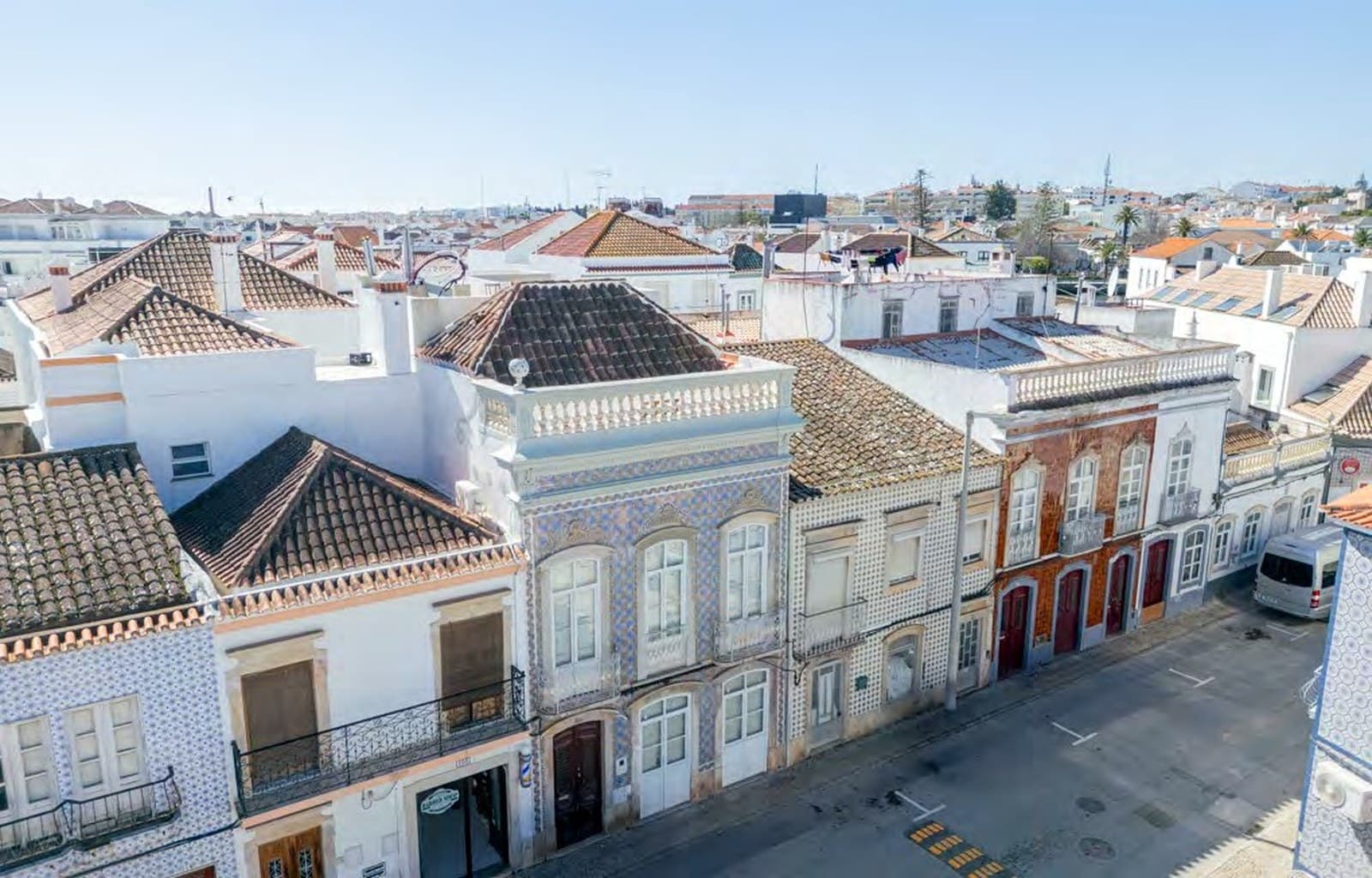 Elevated view of the Villa Borcklund roofline within the Tavira streetscape