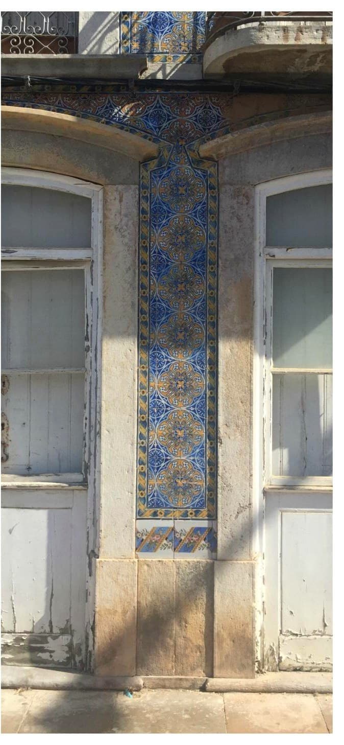 Hand-painted azulejo pilaster, in situ on the main facade